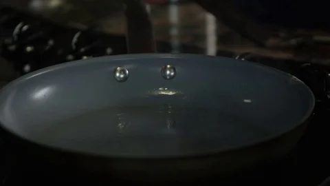 Eggs being cooked inside a pan Stock Footage 69887591