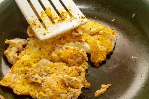 Eggs being cooked in a pan Stock Photos