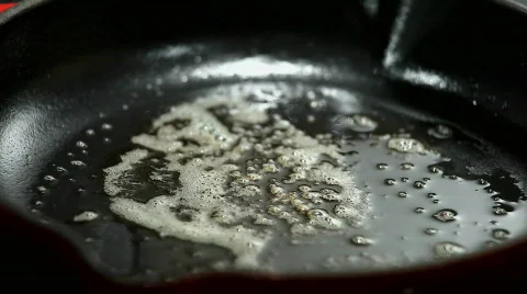 Eggs being fried sunny side up Stock Footage 296164
