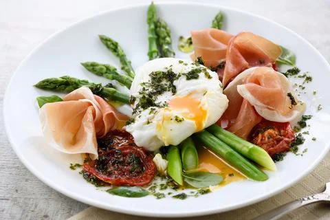 Eggs Benedict with Asparagus and Ham Stock Photos