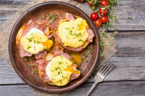 Eggs benedict with bacon Stock Photos