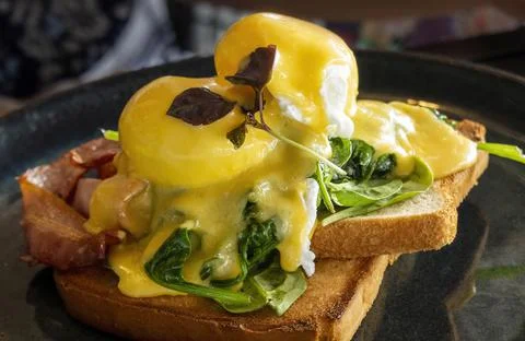Eggs Benedict With Bacon Stock Photos