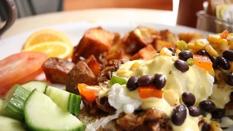 Eggs Benedict Black beans hash browns 스톡 동영상 126673948