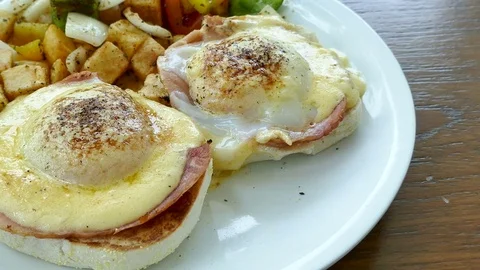Eggs Benedict with tomato Stock Footage 82382726