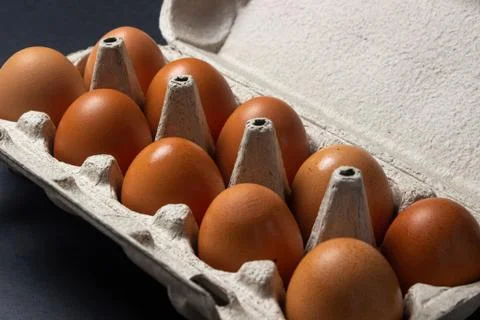 Eggs on a black background. Stock Photos