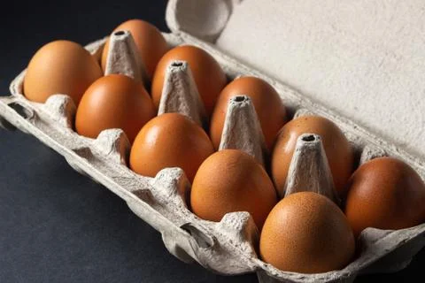 Eggs on a black background. Stock Photos