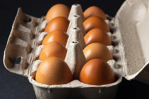 Eggs on a black background. Stock Photos