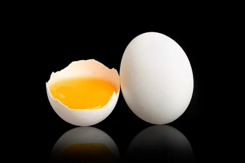 Eggs on black Stock Photos