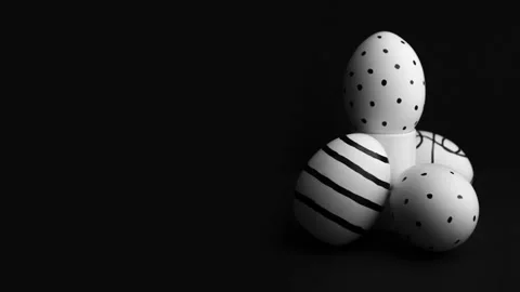 Eggs with black striped pattern on stand, dotted pattern Stock Footage 231141102