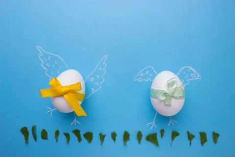 Eggs on blue background Stock Photos