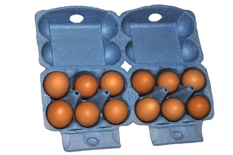 Eggs in blue packaging Stock Photos