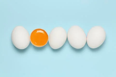 Eggs on blue Stock Photos