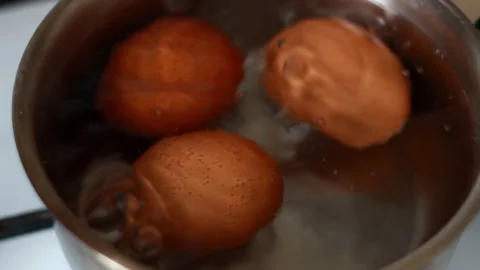 Eggs boiling in hot water. Close-up Stock Footage 260869339