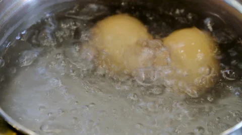 Eggs boiling in a pan Stock Footage