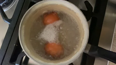Eggs boiling in a pan Stock Footage 188045014