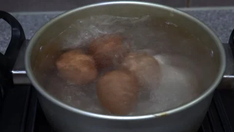 Eggs boiling in a pan Stock Footage 255497646
