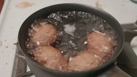 Eggs Boiling in Pot on Stove Stock Footage 80177116