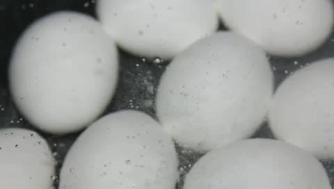 Eggs boiling in water Stock Footage 11019630