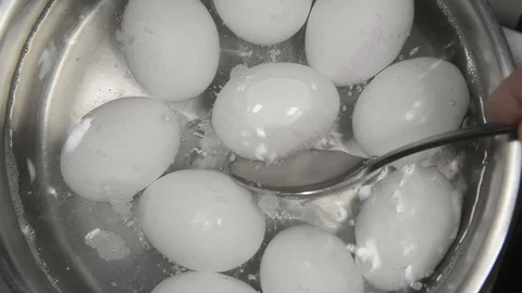 Eggs in boiling water Stock Footage 72715581