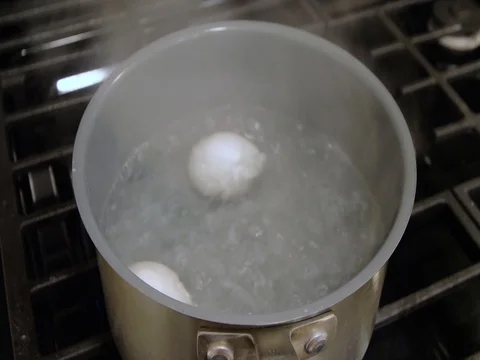 Eggs boiling in water Stock Footage 80359742