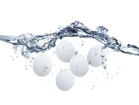 Eggs boiling in the water Stock Photos