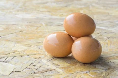 Eggs in bowl, egg on the table, copy space for text. Stock Photos