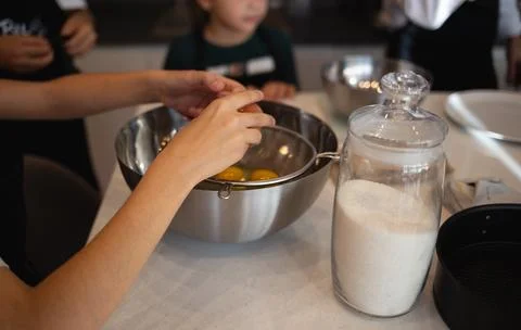 Eggs in a bowl on the kitchen table for making a pie at a culinary master class Stock Photos