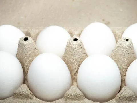 Eggs in a box. A dozen eggs. Kitchen. Stock Photos