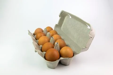 Eggs in a box on a white background Stock Photos