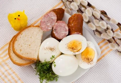 Eggs with bread and sausage Easter food Stock Photos