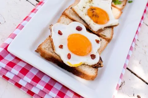 Eggs on bread Stock Photos