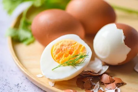 Eggs breakfast, fresh peeled eggs menu food boiled eggs in a wooden plate d.. Stock Photos