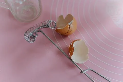 Eggs broken into two halves against a white background. eggs on the table, .. Stock Photos