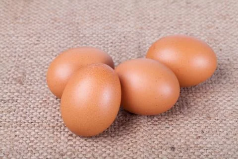 Eggs on brown sack Stock Photos