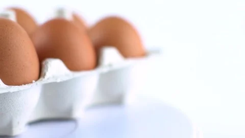 Eggs with brown shell isolated on white Stock Footage 72517344