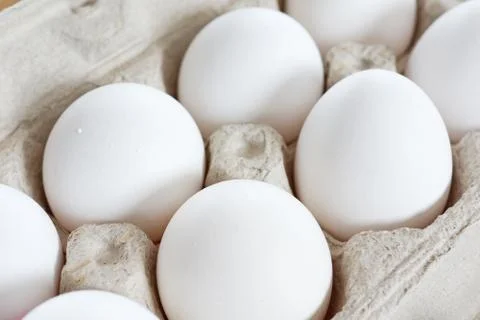 Eggs in cardboard crate Stock Photos