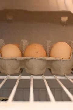 Eggs in a carton inside a refrigerator Fotos de archivo