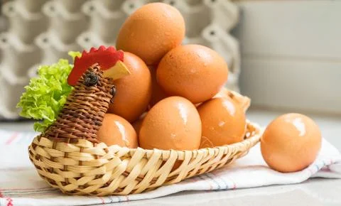 Eggs in a chicken basket Stock Photos
