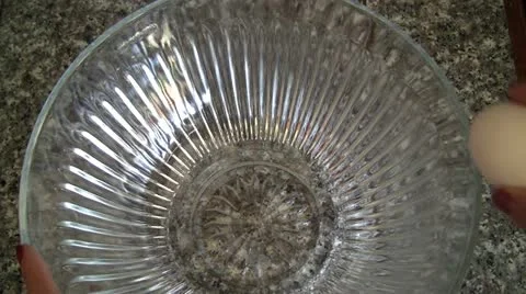 Eggs cracked into bowl close up Stock Footage 10917512