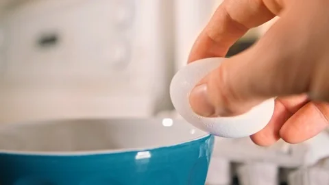 Eggs cracking in bowl slow motion Stock Footage 126058023