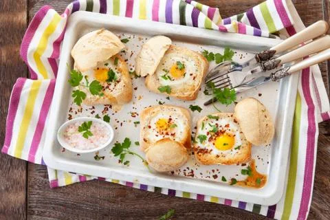 Eggs in crunch bread rolls Stock Photos