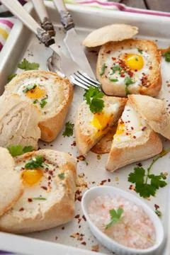 Eggs in crunchy bread rolls Stock Photos