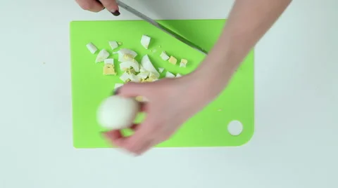 Eggs cut into pieces Stock Footage 62022926