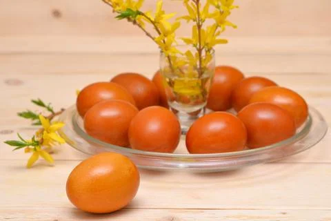 Eggs decorated for easter and spring flowers on the table Stock Photos