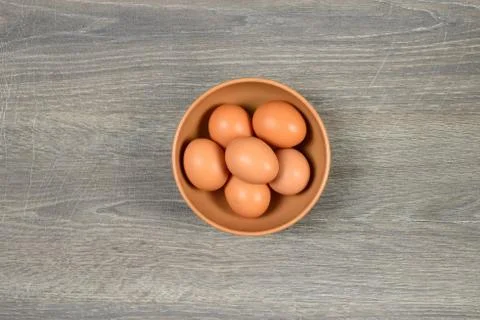 Eggs in deep dish on the table Stock Photos