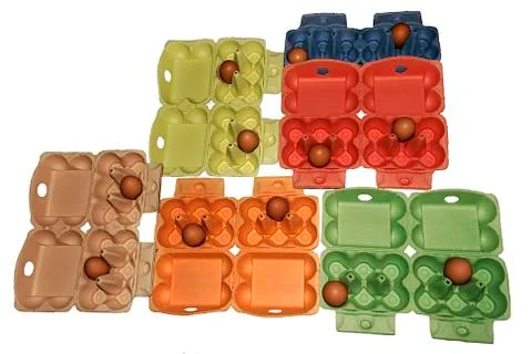 Eggs in different colored packaging Stock Photos
