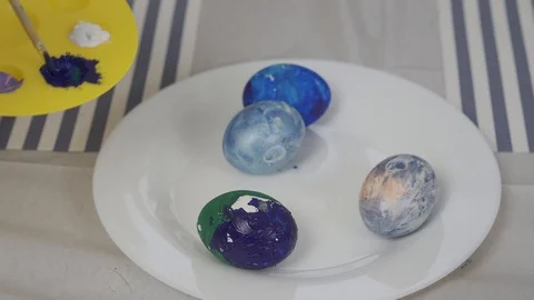 Eggs of different colors. Easter preparation. four eggs of different colors Video stock 127963449