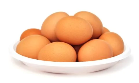 Eggs in a dish (isolated) Stock Photos