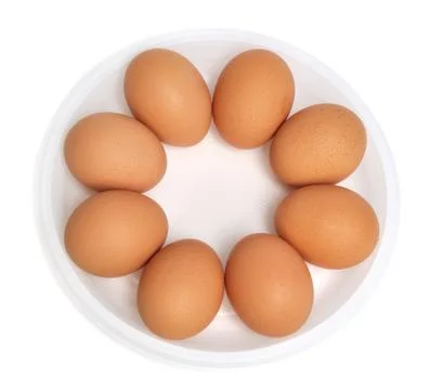 Eggs in a dish (isolated) Stock Photos