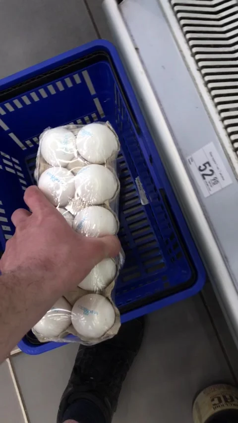 Eggs on display in supermarket boxes for shoppers to choose Stock Footage 308368375